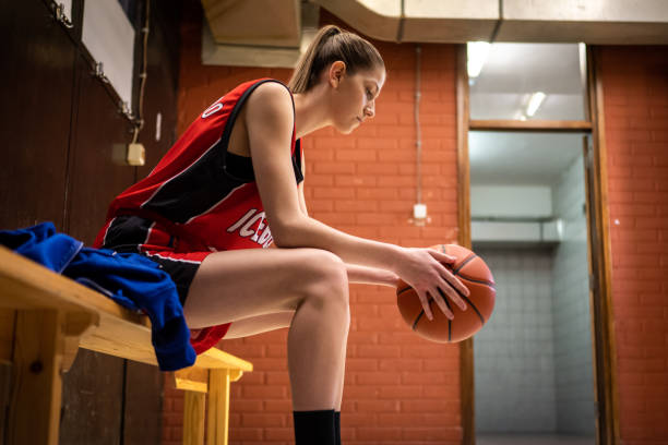 istock Basketball player holding ball 1498634506