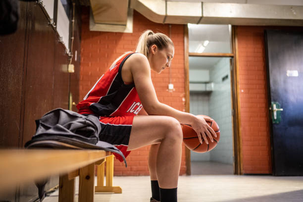istock Basketball player holding ball 1498634520