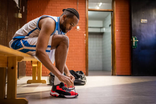 istock Male player tying shoelaces 1498634530