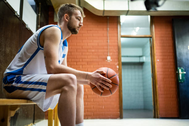 istock Male player holding basketball 1498634533