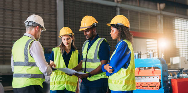 istock Engineers or foreman inspecting and check up machine at factory machines. Worker industry working in the metal sheet company. 1498635865