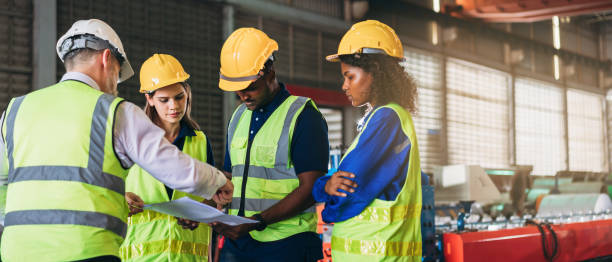 istock Engineers or foreman inspecting and check up machine at factory machines. Worker industry working in the metal sheet company. 1498635896