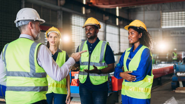 istock Engineers or foreman inspecting and check up machine at factory machines. Worker industry working in the metal sheet company. 1498636576