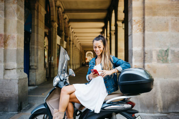istock Young woman on a scooter 1498636715