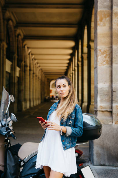 istock Young woman on a scooter 1498636729