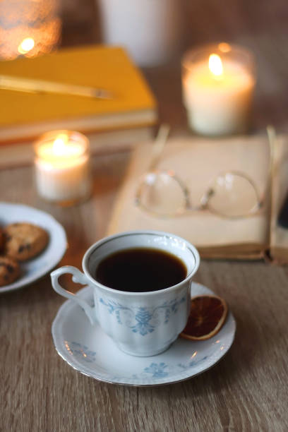 istock Books, Glasses, E-Reader, Pen, Tea, Cookies and Candles 1498636974