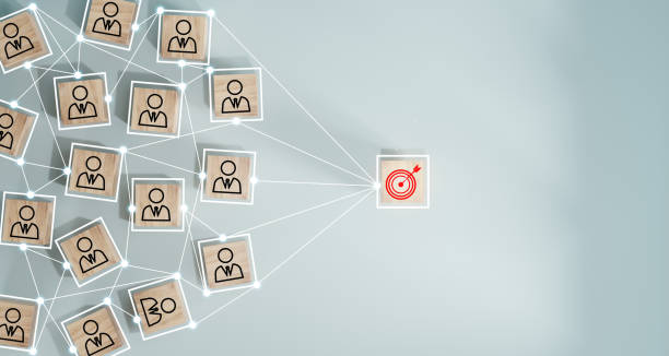 istock Red dartboard and black arrow connection linkage with human icon for customer focus target group and customer relation management concept. 1498638244