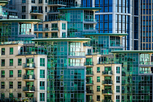 The ultra modern facade of the luxury apartment complex at St George Wharf by the river Thames in Vauxhall, London, UK.