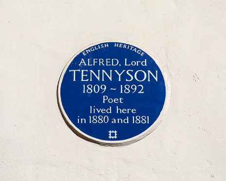 London, UK - March 14th 2023: Close-up of a blue plaque, located on Upper Belgrave Street in London, UK, marking the location where poet Alfred Lord Tennyson once lived.
