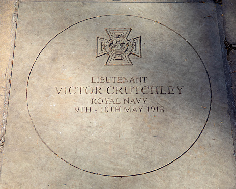 A stone plaque in Sloane Square, London, UK, dedicated to Lieutenant Victor Crutchley who won the Victoria Cross in May 1918 for his heroic actions during the Second Ostend Raid.
