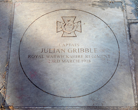 A stone plaque in Sloane Square, London, UK, dedicated to Captain julian Gribble who won the Victoria Cross in March 1918 for his heroic actions during the First World War.