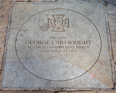 A stone plaque in Sloane Square, London, UK, dedicated to Private George Cartwright who won the Victoria Cross in August 1918 for his heroic actions during the First World War.