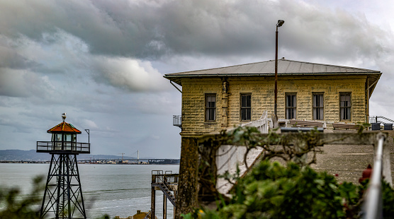 Panoramic view of the guardtower of the federal prison on Alcatraz Island in the middle of the bay of San Francisco, California, USA. Jail Concept.