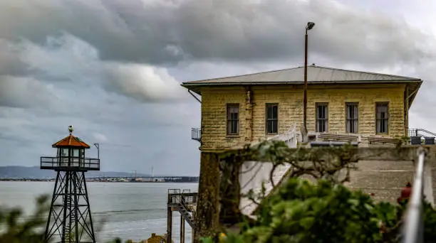 Photo of Panoramic view of the guardtower of the federal prison on Alcatraz Island in the middle of the bay of San Francisco, California, USA.