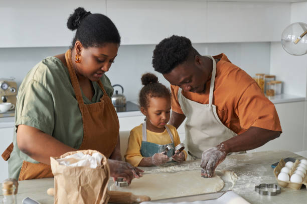 istock Family using baking mould to make cookies 1498642867