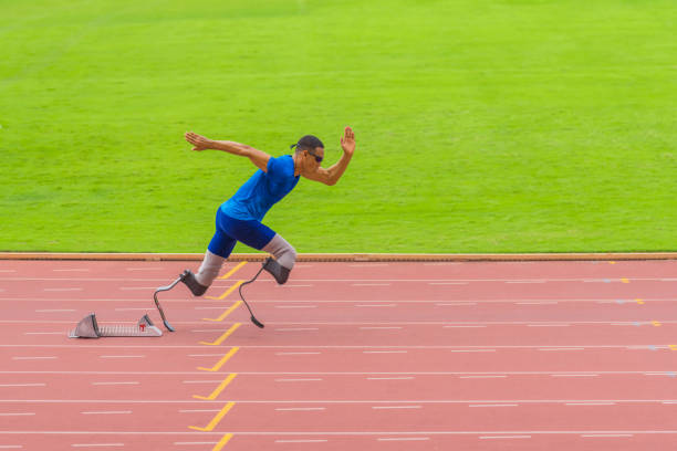 istock Athlete with prosthetics sprints instantly from start, displaying exceptional speed on stadium track 1498644986
