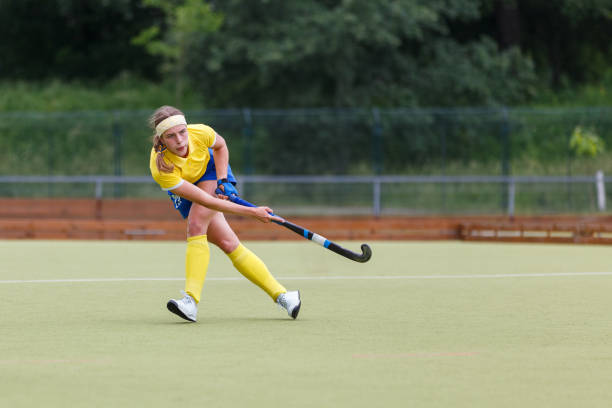 istock Field hockey player making pass to a teammate 1498646669