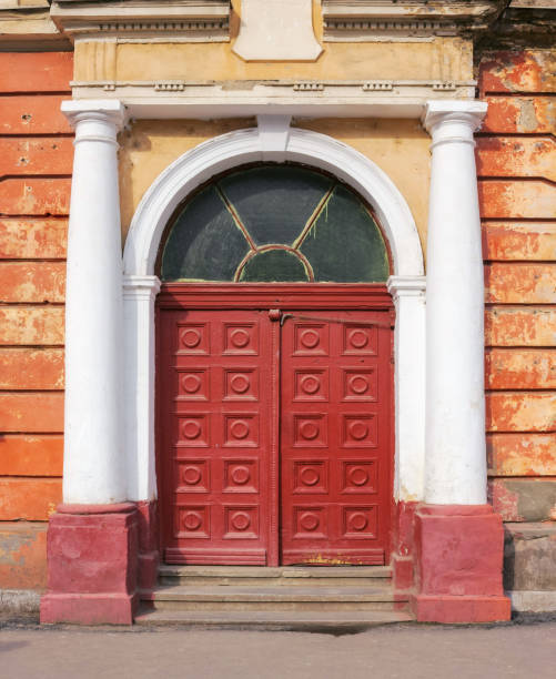 istock wooden door on the ancient facade 1498646947
