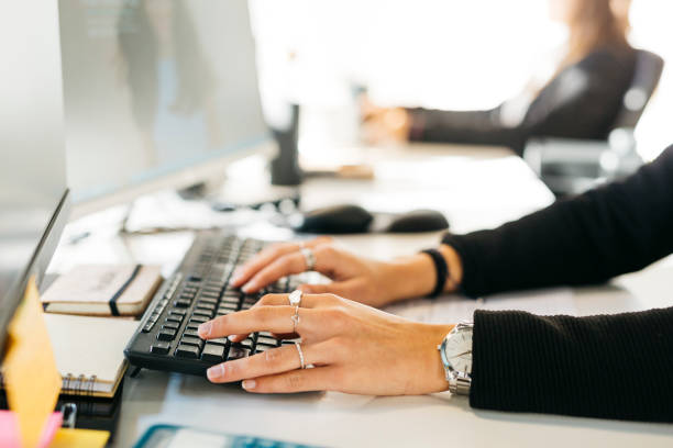 istock Woman typing a keyboard in an office 1498647958
