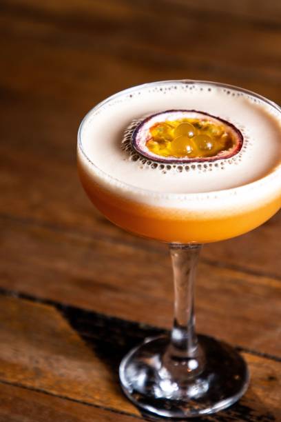 istock Exotic cocktail made with passion fruit, atop a wooden tabletop 1498648252