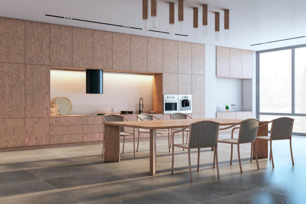 istock Perspective view of modern kitchen interior design with wooden dining table with chairs, tiles floor and contemporary lamps. 3D Rendering 1498648342