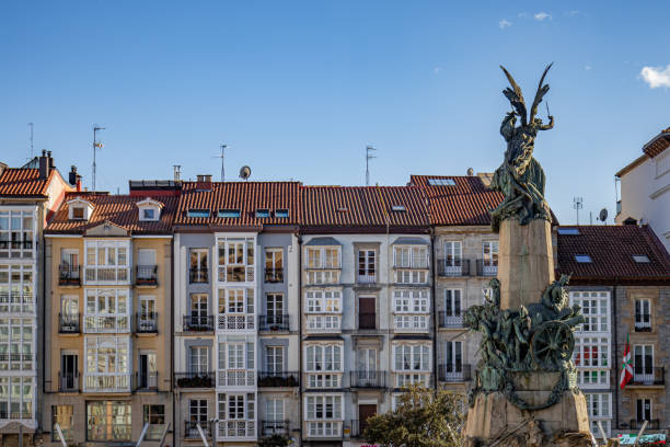 War memorial on the Plaza Virgen Blanca from behind with the view of facades of houses
