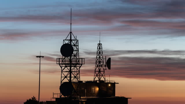 timelapse of 5G signal tower at sunset
