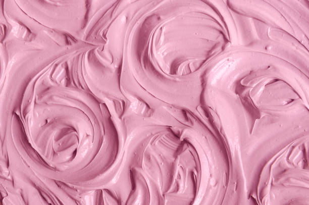 istock Rose cosmetic clay (make-up blusher, lipstick, alginate facial mask, berry body wrap) texture close-up, selective focus. Abstract background with swirl brush strokes. 1498653596