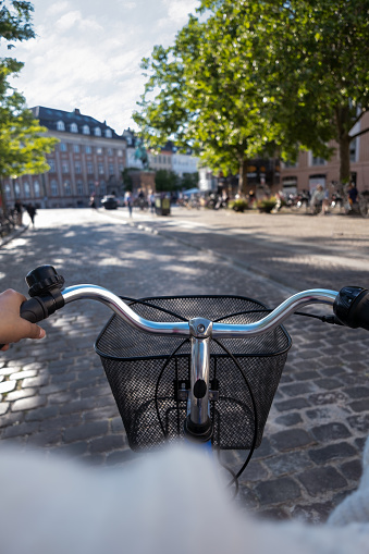POV of woman exploring the city of Copenhagen by bike