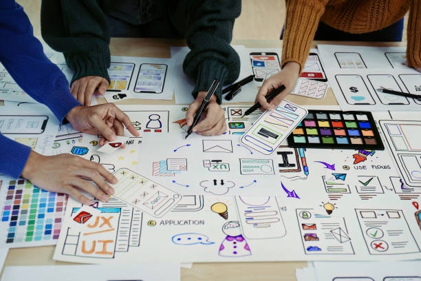 istock Team of Creative Web, Graphic Designer planning, drawing website ux ui app for mobile phone application and development template layout, process to developing prototype wireframe. 1498664372