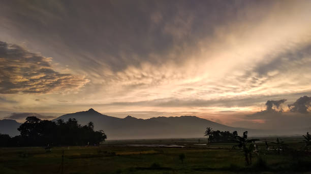 istock Landscape dramatic sunset sky Telomoyo mountain rice field tropical climate 1498668058