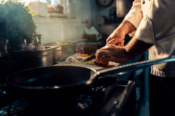 istock Chef cooking in a commercial kitchen. 1498674579