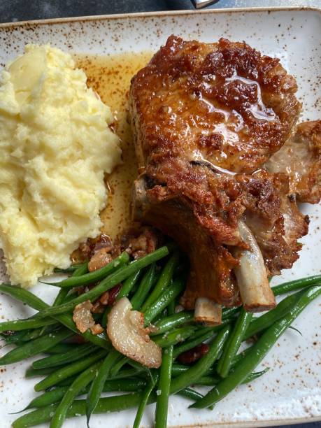 istock Pork chop, mashed potatoes and green beans 1498674965