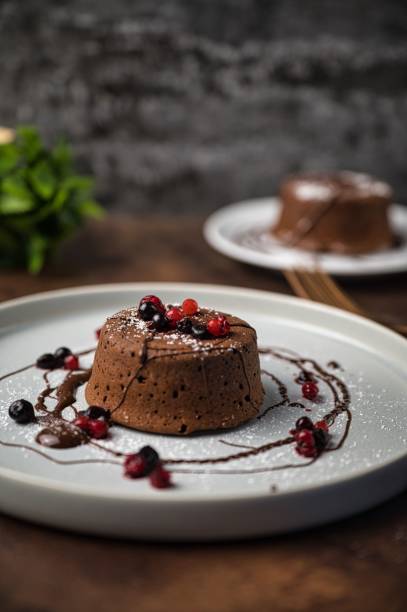istock Delicious, fresh, warm chocolate souffle topped with berries 1498679273
