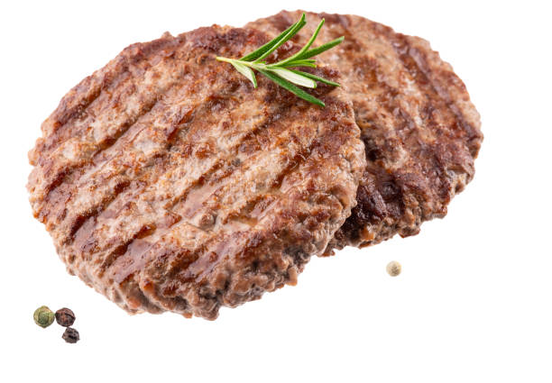 istock Beef cutlet grill with stripes outdoors with fresh rosemary branch isolated on white background. 1498686150