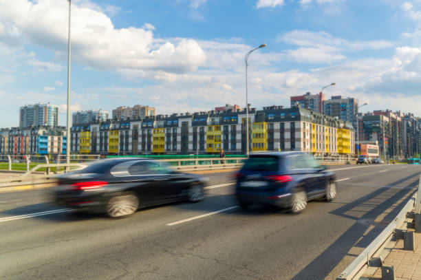 istock One car overtakes another on the street. 1498692057