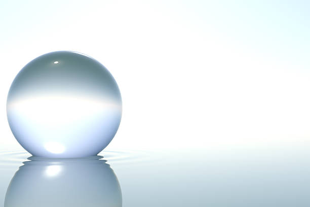 istock Zen glass sphere in water on white background 149869799
