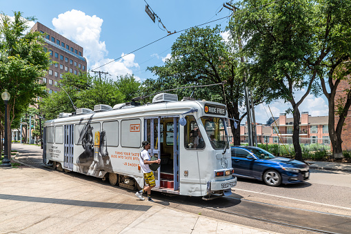 Dallas, Texas, USA. 2 June 2023. Man enters a tram public transport in Dallas