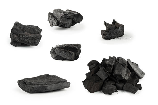 istock Black oak coal isolated on white background. 1498702924