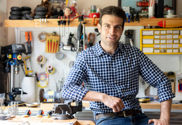 istock Man in his man cave working on a DIY project 1498704787