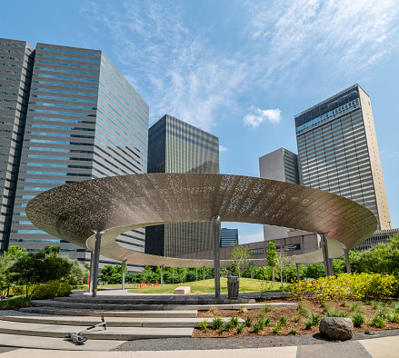 Circular sun shade at Pacific Plaza in Dallas, Texas. Public Park.