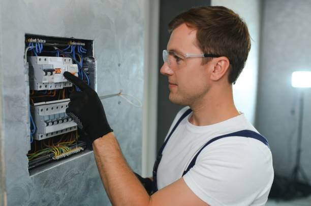 istock A male electrician works in a switchboard with an electrical connecting cable 1498707752