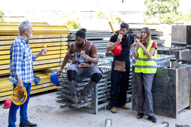 istock A Multi-Ethnic Group of Construction Workers is Taking a Break and Eating. 1498718465