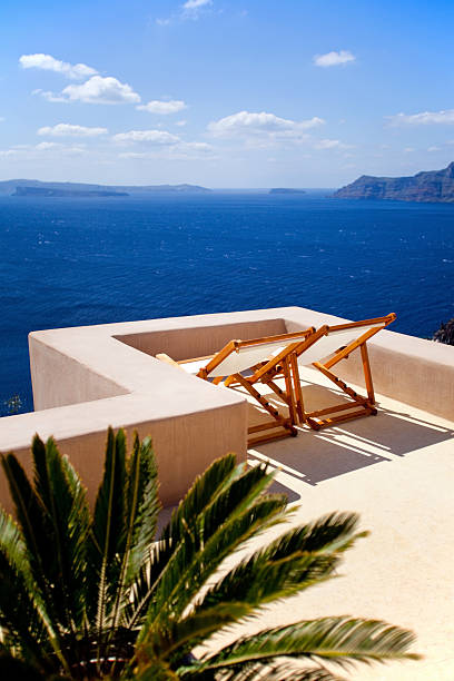 Sunbathing with sea view in Santorini luxury hotel
