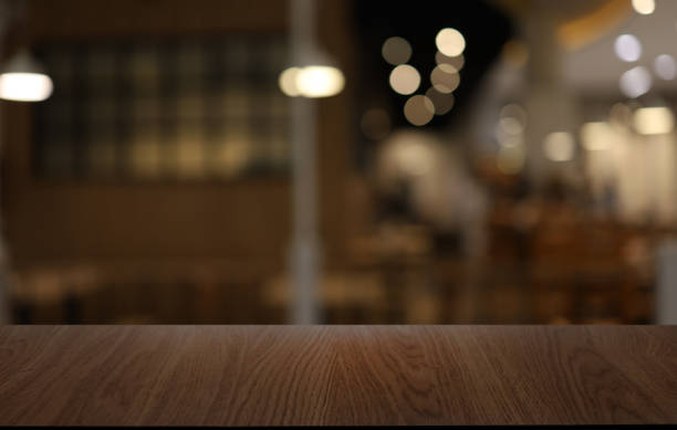 istock Wood table top in front of abstract blurred background. Empty wooden table space for text marketing promotion. blank wood table surface copy space 1498723108