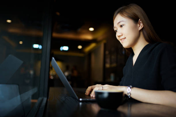istock Woman drinking a coffee and working in cafe. 1498723220