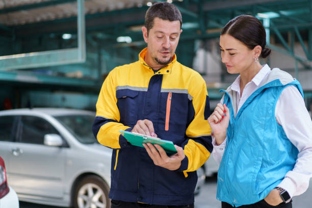istock Vehicle technician talking with female customer. 1498723528