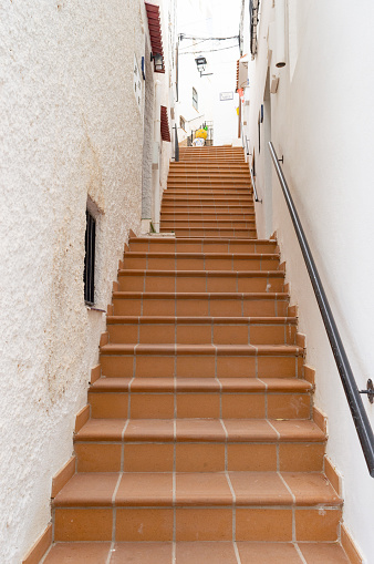 Staircase in narrow street of town