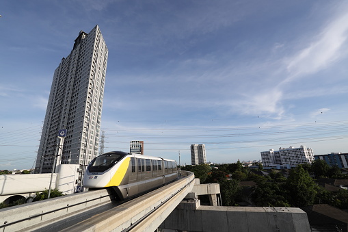 Bangkok, Thailand - June 04, 2023:  The yellow line monorails sky train in Bangkok, connected the Samut Prakarn province to Bangkok