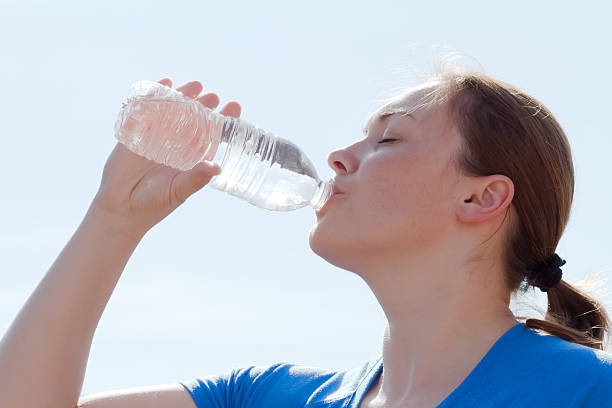 istock woman drinking water 149872678